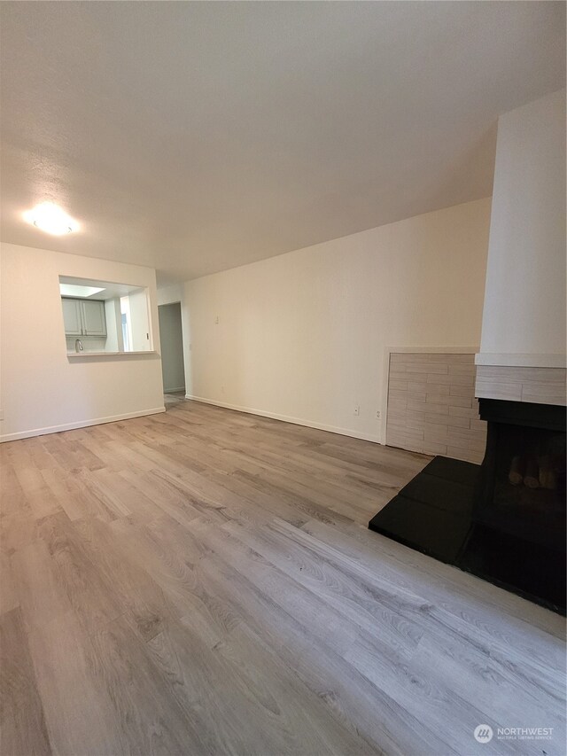 unfurnished living room with light wood-type flooring