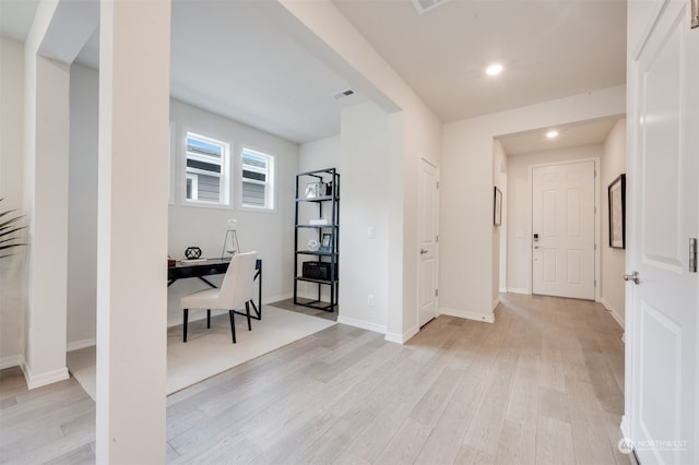 office with light hardwood / wood-style flooring