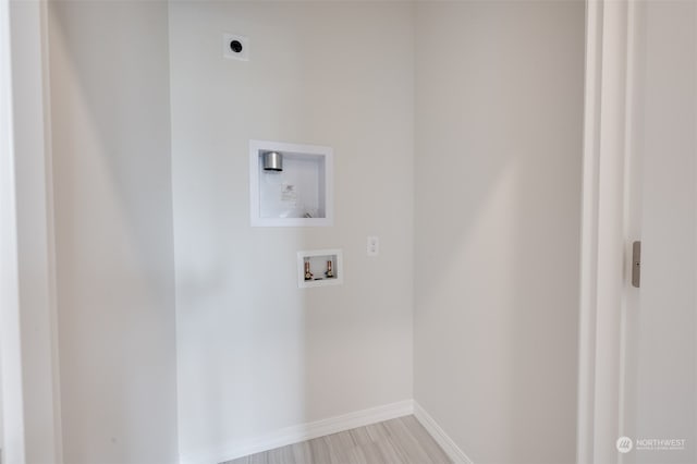 laundry area with hookup for a washing machine and hookup for an electric dryer