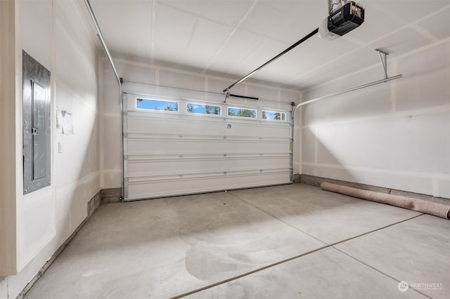 garage featuring electric panel and a garage door opener