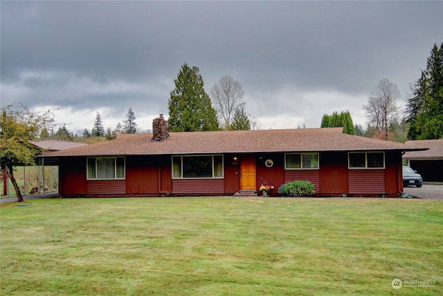 single story home featuring a front yard