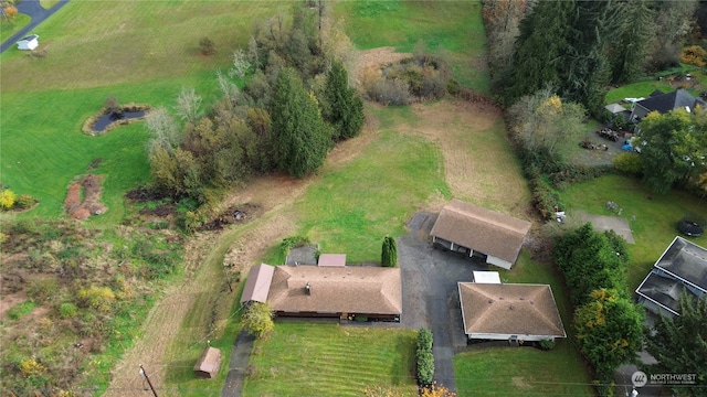 birds eye view of property featuring a rural view