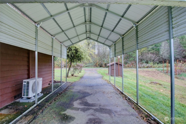 view of vehicle parking with a carport, a yard, and ac unit