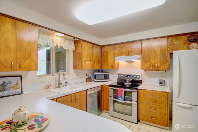 kitchen with appliances with stainless steel finishes and sink