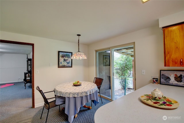 dining area featuring carpet