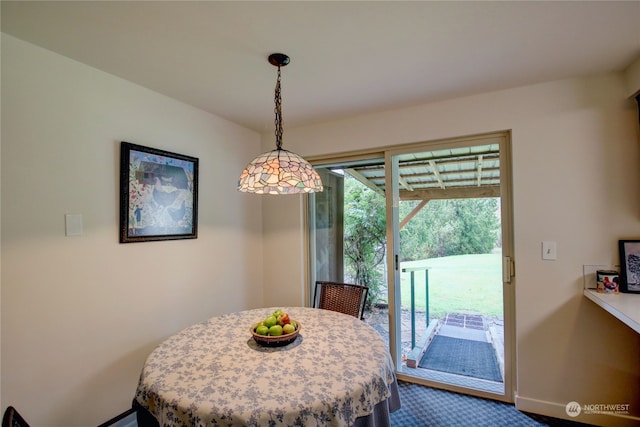 view of carpeted dining space