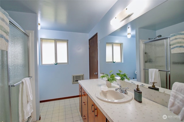 bathroom with walk in shower and vanity