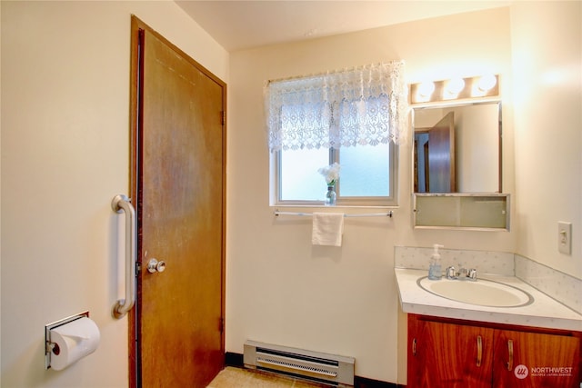 bathroom featuring vanity and baseboard heating