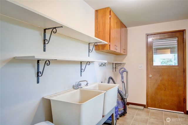 washroom with cabinets and hookup for a washing machine