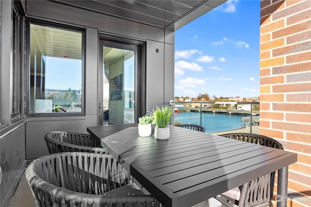 balcony featuring a water view