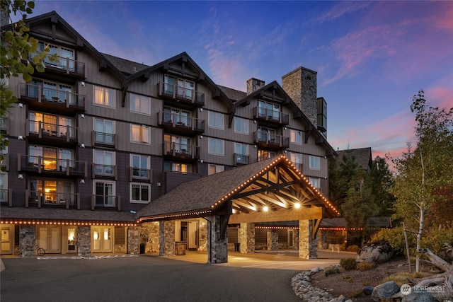 view of outdoor building at dusk