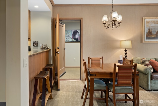 dining area with light carpet and an inviting chandelier