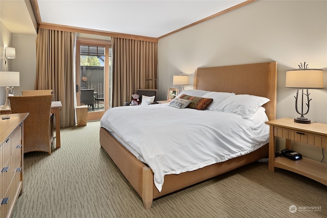 carpeted bedroom featuring ornamental molding and access to outside