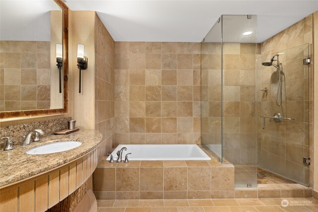 bathroom with sink, tile patterned floors, and independent shower and bath