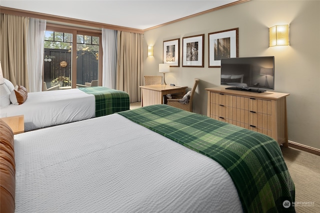 bedroom featuring access to exterior and crown molding