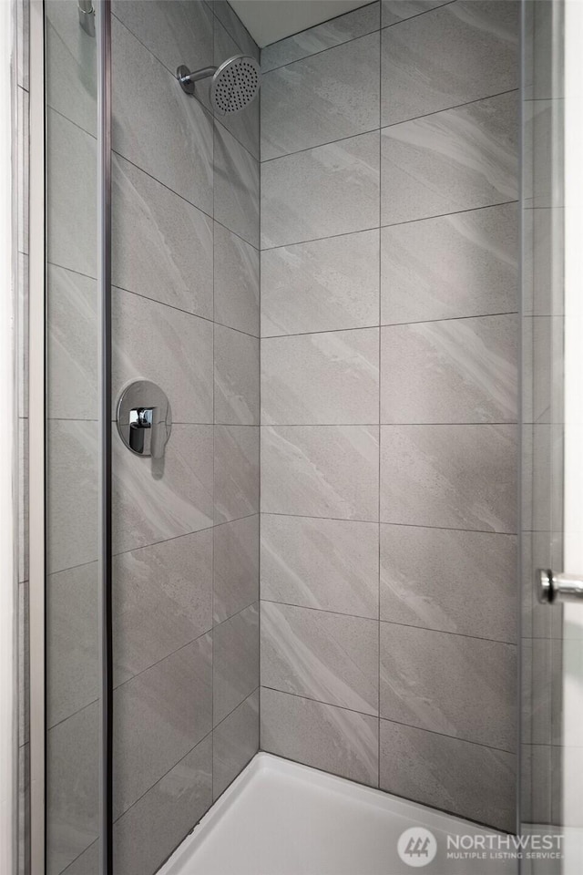 full bathroom featuring a shower stall