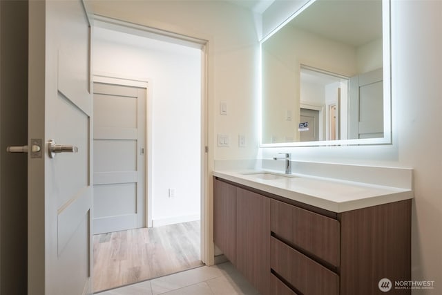 bathroom featuring tile patterned flooring and vanity