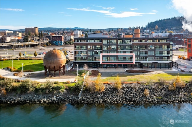 exterior space featuring a water and mountain view