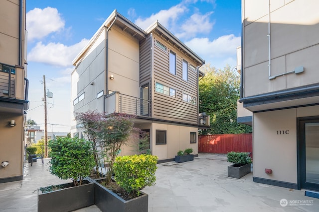 view of side of home featuring a patio area