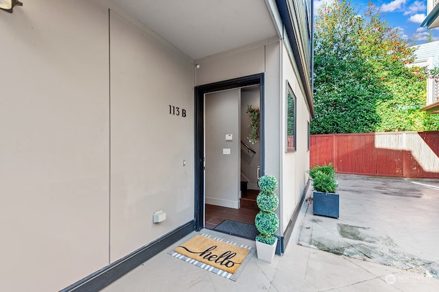 doorway to property with a patio area