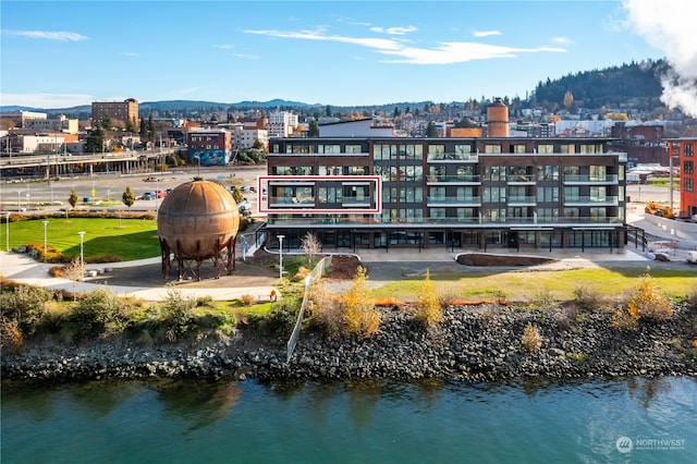 exterior space featuring a water and mountain view