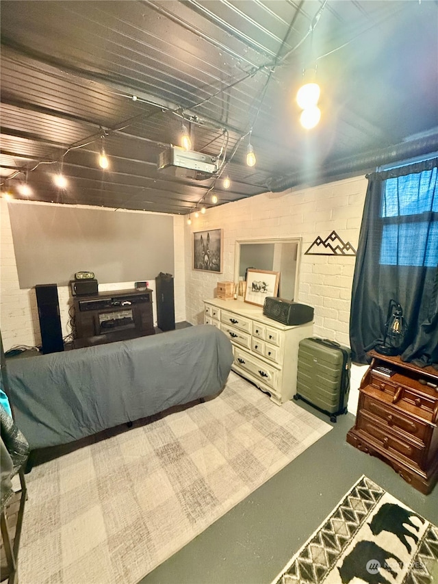 bedroom featuring concrete flooring