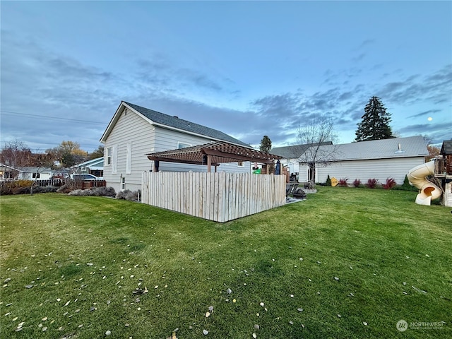 view of home's exterior with a yard and a gazebo