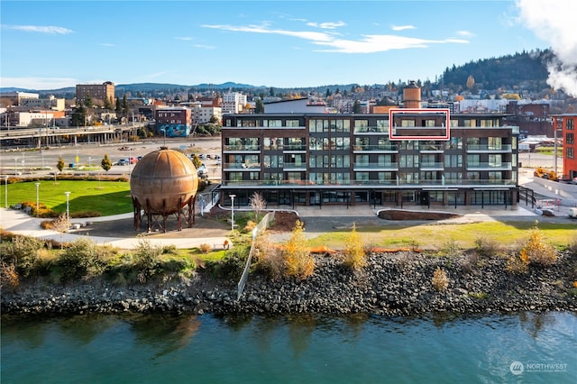 exterior space featuring a water and mountain view