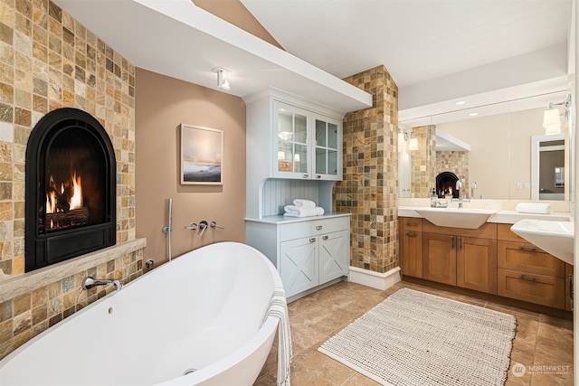 bathroom featuring vanity and a tub