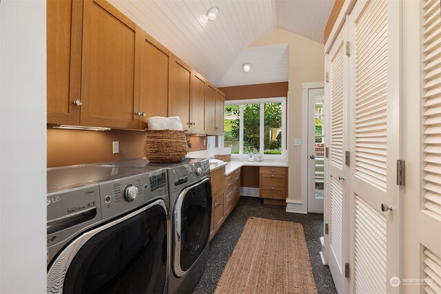 laundry area featuring independent washer and dryer, wooden ceiling, dark carpet, and cabinets