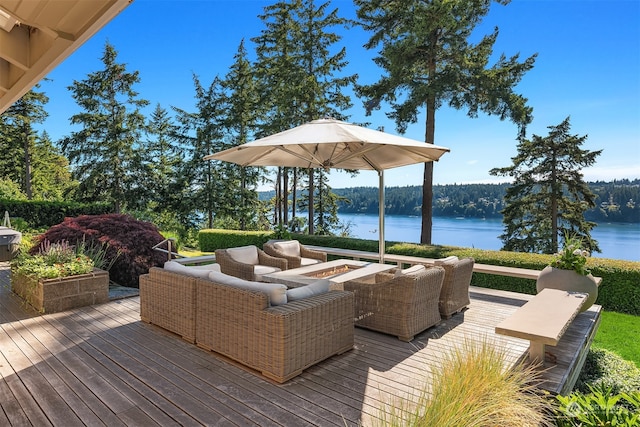 deck featuring an outdoor hangout area and a water view