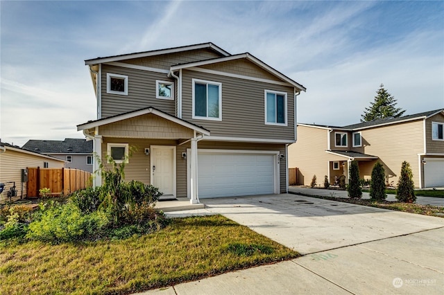 view of front facade featuring a garage and a front yard