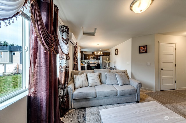 carpeted living room with an inviting chandelier