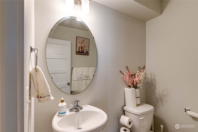 bathroom with a sink and toilet