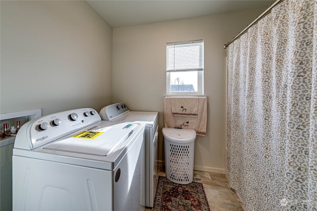 laundry room featuring separate washer and dryer