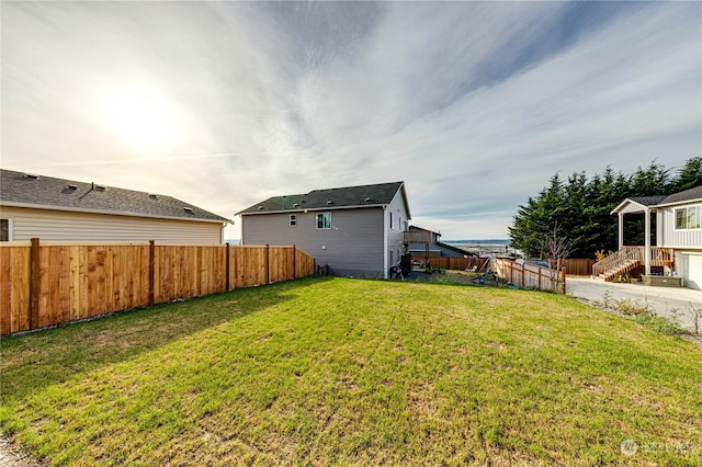 view of yard with a fenced backyard