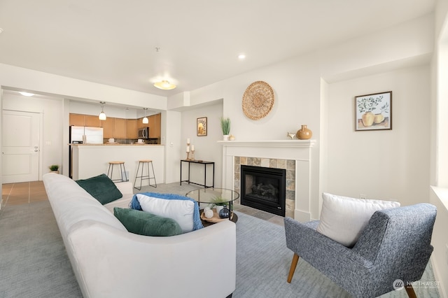 carpeted living room with a fireplace