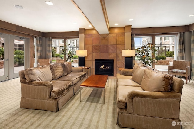 1545NW 57th St Unit 505, Seattle, WA 98107 - carpeted living room featuring a tiled fireplace, recessed lighting, and french doors