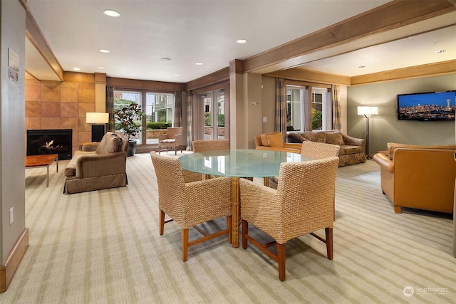 1545NW 57th St Unit 505, Seattle, WA 98107 - dining space featuring light carpet, a tile fireplace, and recessed lighting