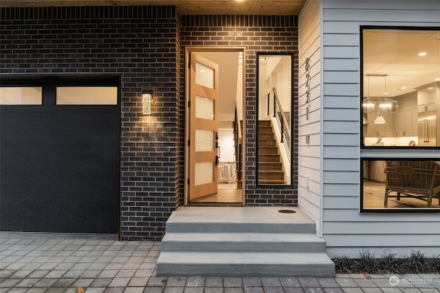 entrance to property featuring a garage