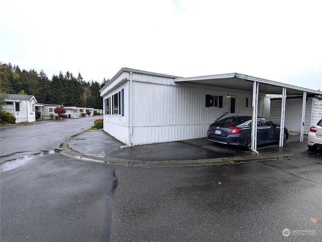 exterior space with a carport