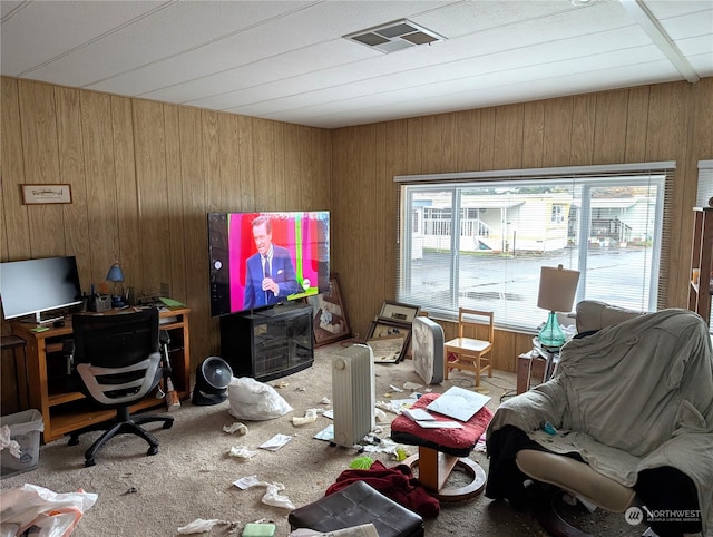 interior space with wood walls and carpet flooring