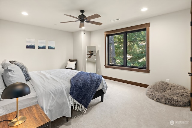 bedroom with ceiling fan and carpet