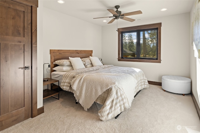 carpeted bedroom featuring ceiling fan