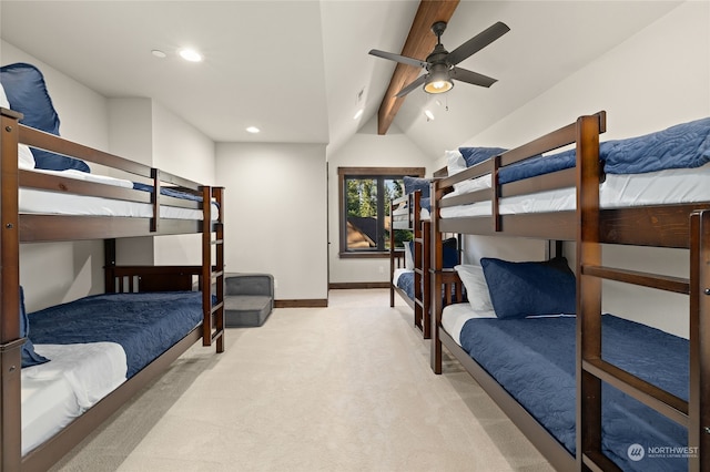 carpeted bedroom featuring lofted ceiling with beams and ceiling fan