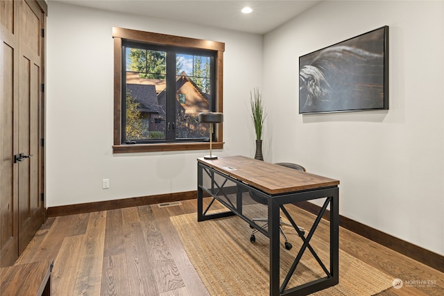 office area with wood-type flooring