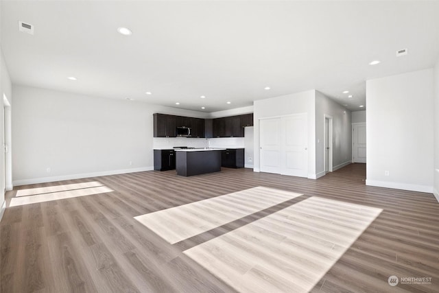 unfurnished living room featuring light wood-type flooring