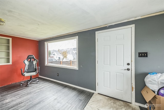 foyer entrance featuring a textured ceiling and hardwood / wood-style flooring