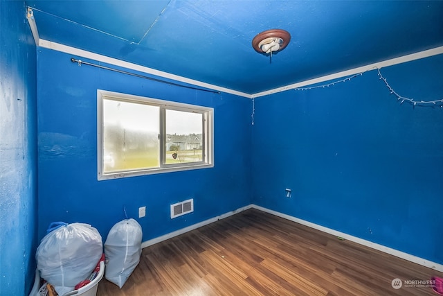 spare room with hardwood / wood-style flooring