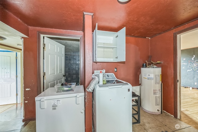 clothes washing area with washer and dryer, light tile patterned floors, and water heater